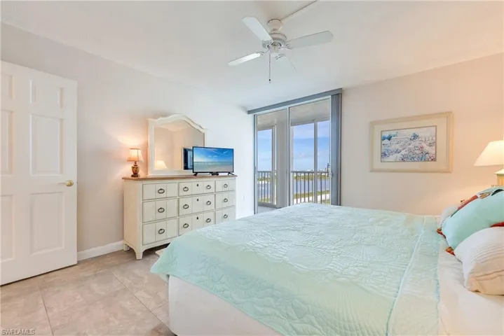 Bedroom with access to exterior and ceiling fan