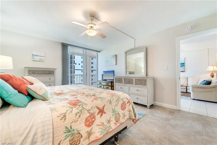 Bedroom with access to exterior and ceiling fan