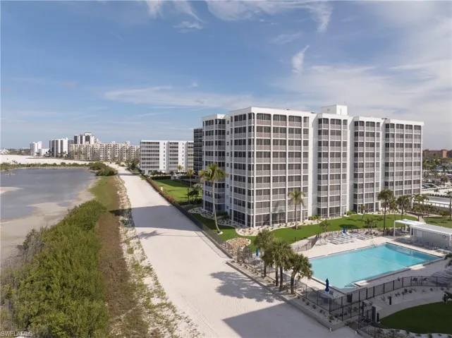 Community pool with a city view, a patio, and a water view