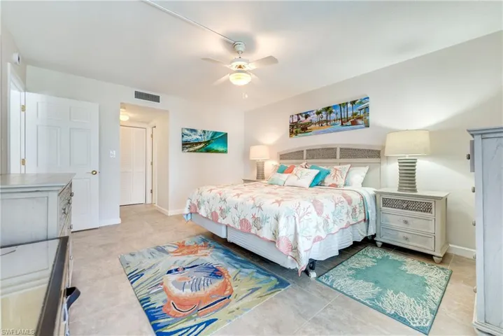 Bedroom featuring ceiling fan and baseboards