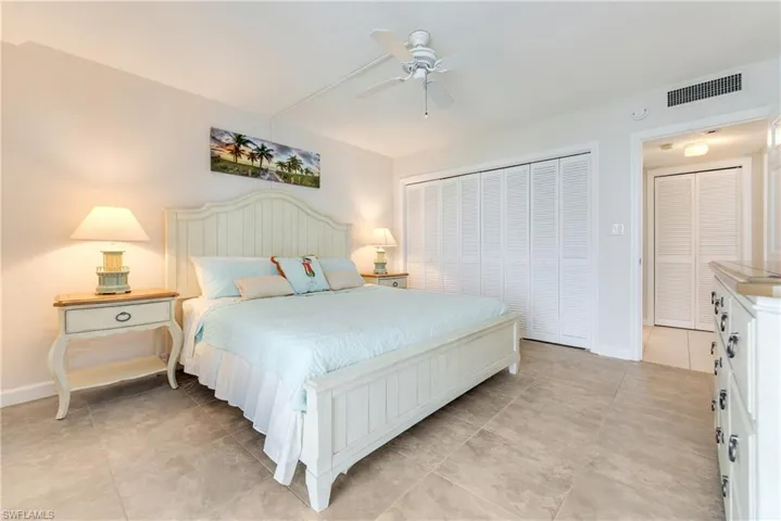Bedroom with a ceiling fan and a closet