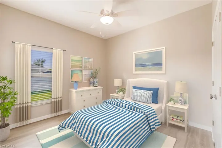 Bedroom featuring light wood-style floors and a ceiling fan