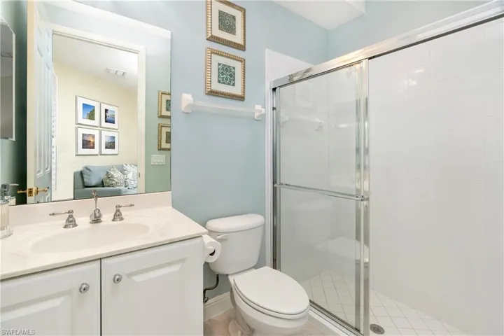 Bathroom with vanity and a shower stall