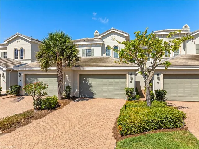 Mediterranean / spanish-style home with decorative driveway, stucco siding, a garage, and a tile roof
