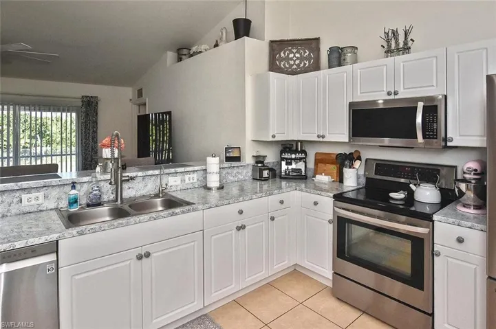 Custom faux-granite counters provide lots of prep space.