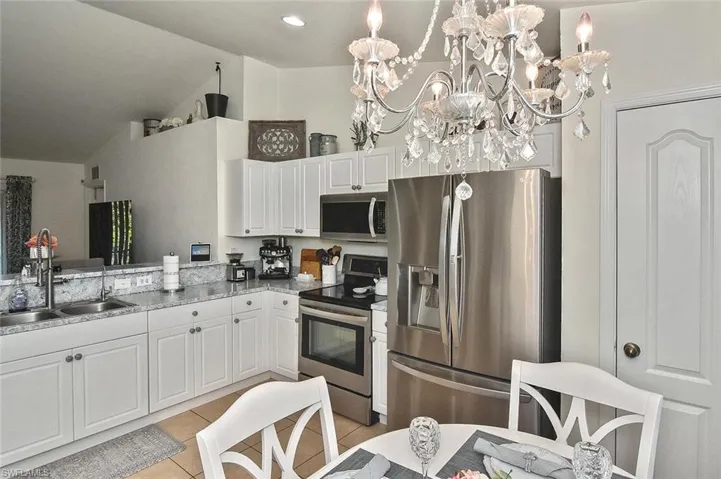 Chandelier stays with the home for a touch of elegance!