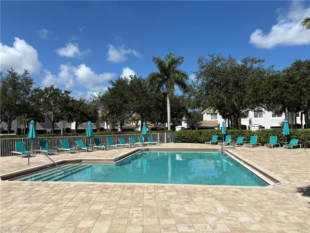 Community pool with a patio area