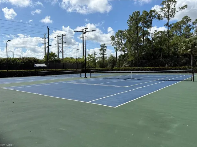 View of tennis court featuring community basketball court