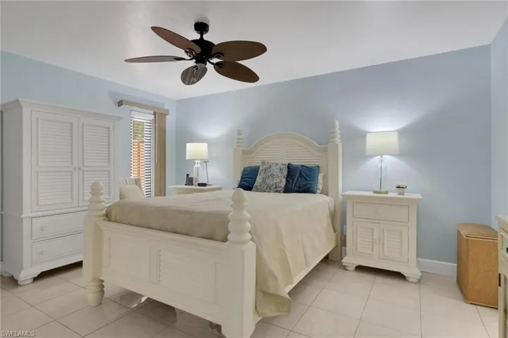 Bedroom featuring ceiling fan and light tile patterned flooring
