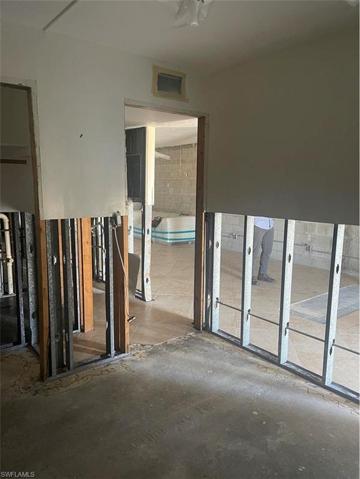Guest bedroom, hall & bath area looking out toward living/dining/kitchen area