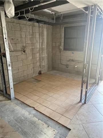 Kitchen area with window facing Estero Blvd and paved parking