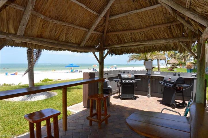 Beachside tiki hut with BBQ area where you can stay in the shade with a cool drink and great view! *Photo Pre Sept 2022