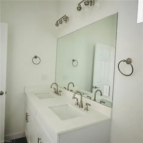 Full bathroom featuring double vanity