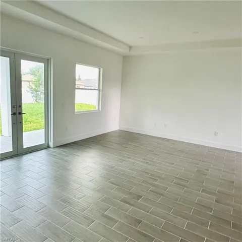 Spare room featuring french doors and wood finish floors