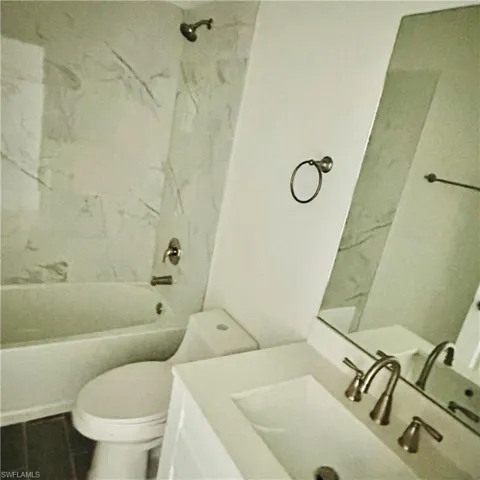 Bathroom with shower / bathtub combination and vanity