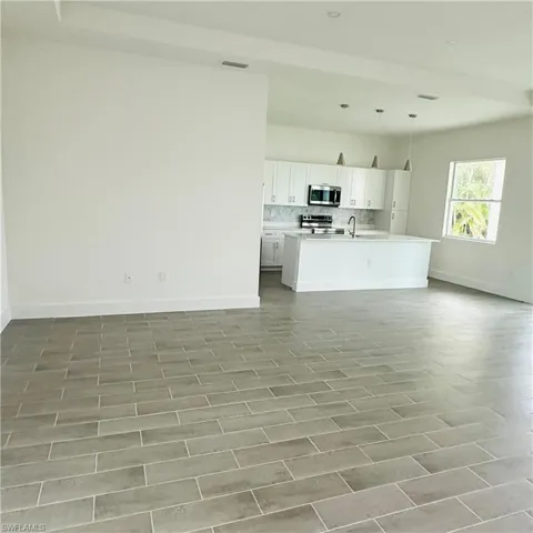 Unfurnished living room featuring light wood-type flooring and recessed lighting