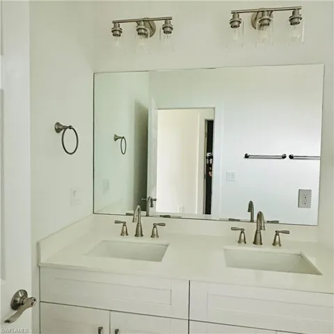 Full bathroom featuring double vanity