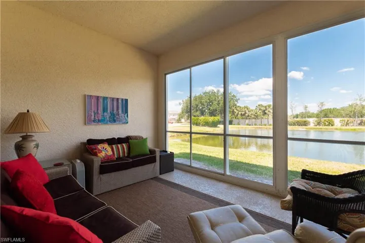 Sunroom with a water view