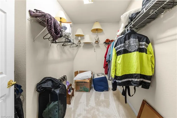 Walk in closet featuring carpet