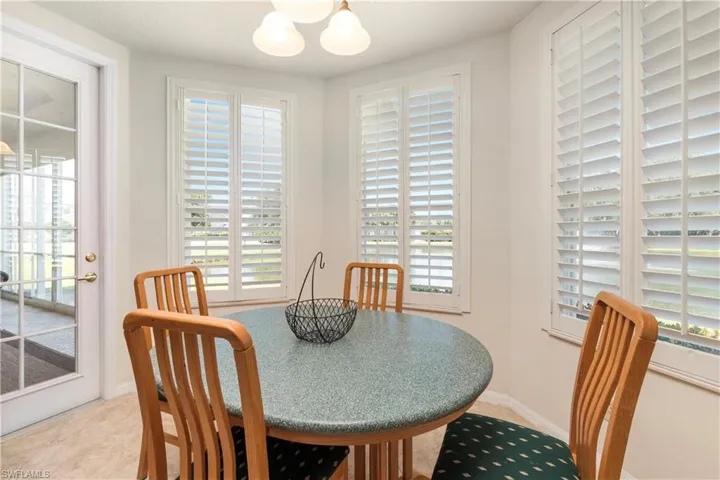 Dining space featuring baseboards and an inviting chandelier