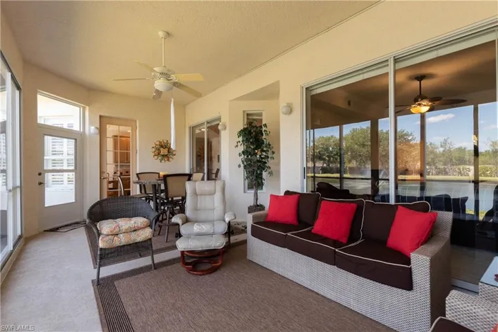 Sunroom / solarium with an outdoor living space and a ceiling fan