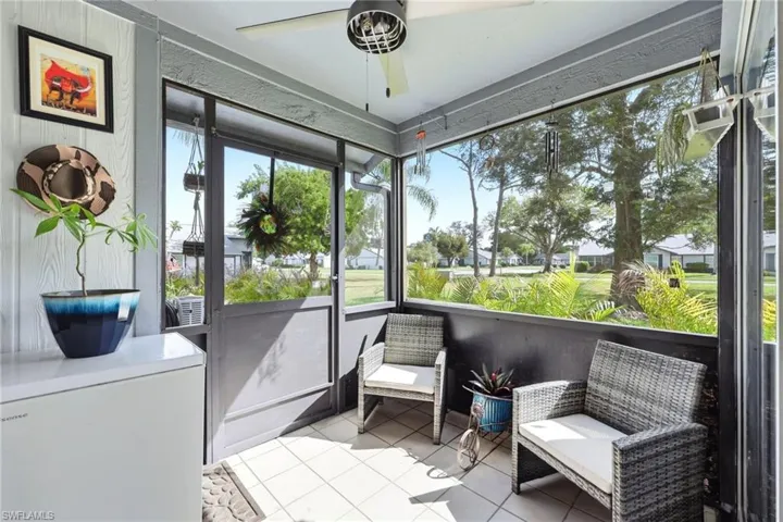 Sunroom featuring a ceiling fan