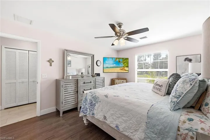 Bedroom with wood finished floors and a ceiling fan