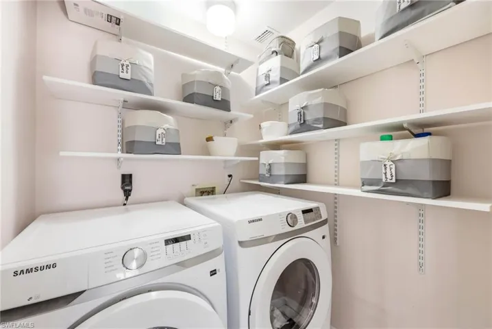 Laundry room with washing machine and dryer