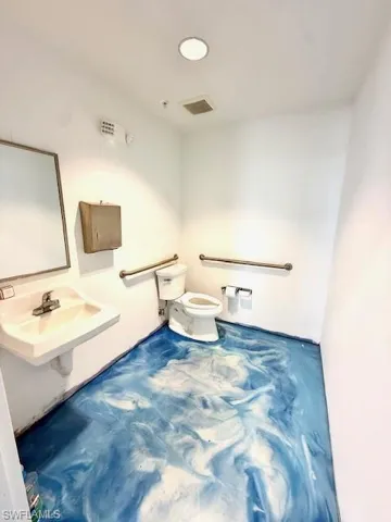 Bathroom featuring toilet and a sink
