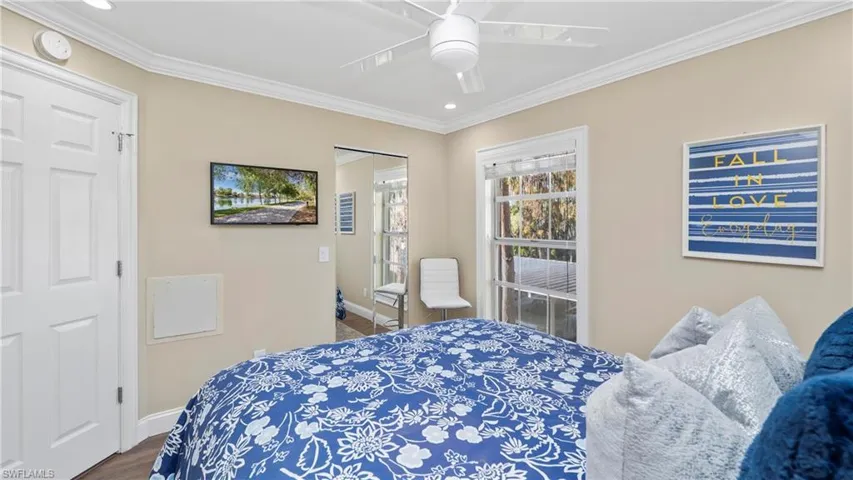 Bedroom with ceiling fan, crown molding, wood finished floors, and recessed lighting