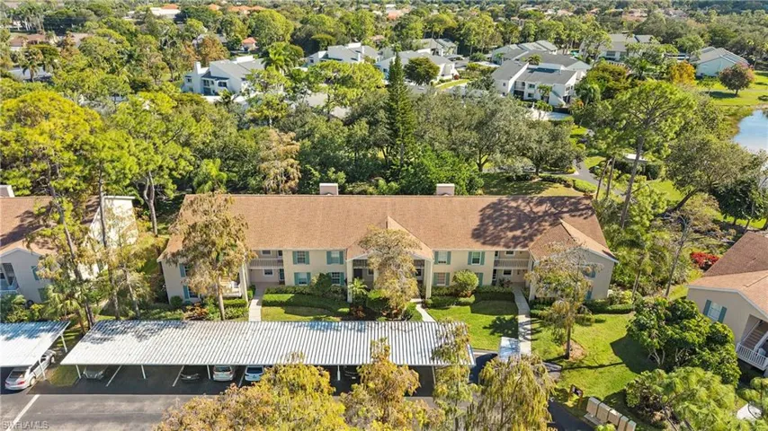 Aerial perspective of suburban area featuring a tree filled landscape