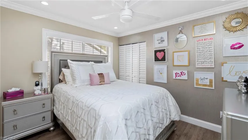 Bedroom featuring ornamental molding, dark wood-style floors, a ceiling fan, and recessed lighting