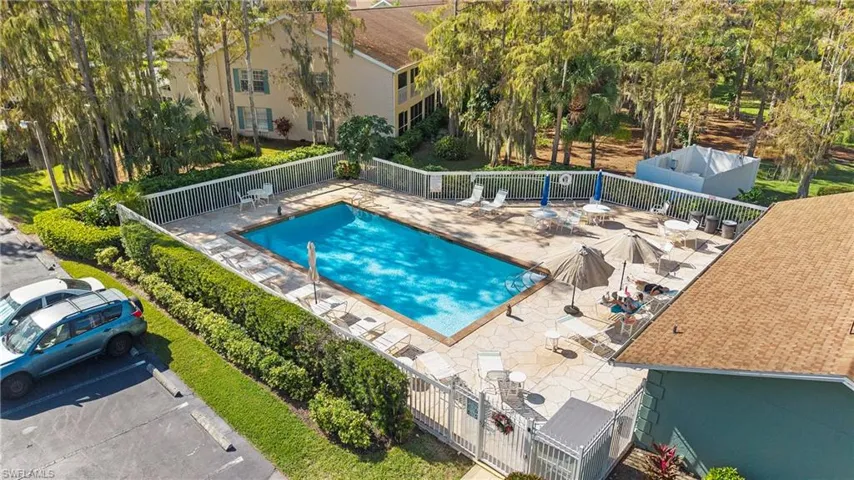 Community pool with a patio