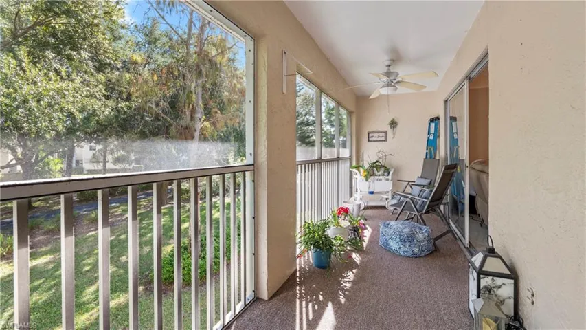 Sunroom / solarium featuring a ceiling fan