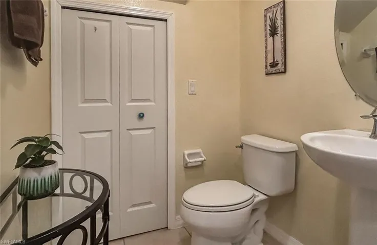Bathroom with tile patterned flooring and toilet