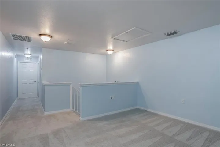 Empty room with light carpet