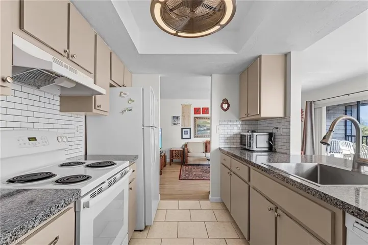 Kitchen featuring a tray ceiling