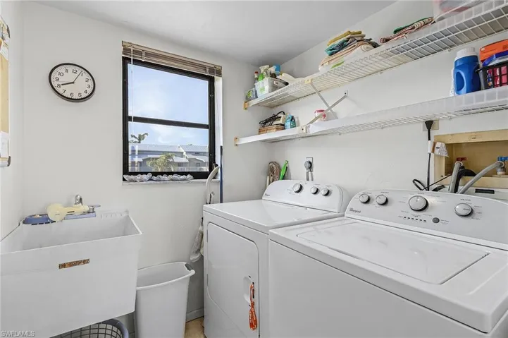 Laundry room with washer/dryer and utility sink