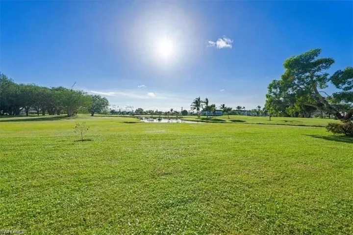 View of green lawn with a water view
