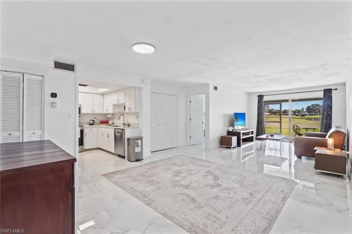 Living area with light marble finish flooring