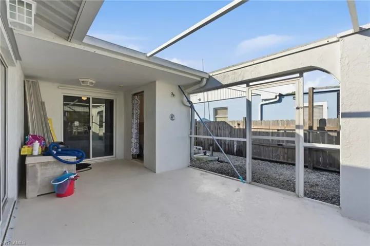 View of patio / terrace featuring a lanai