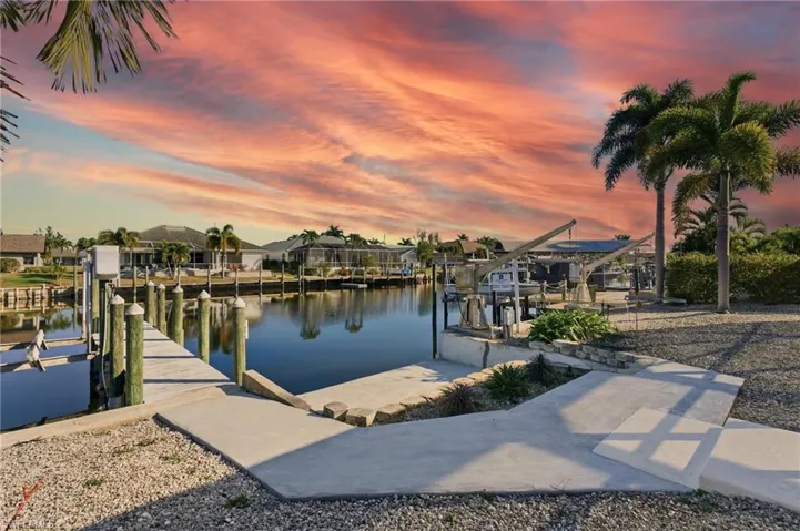 Dock with boat lift and a water view