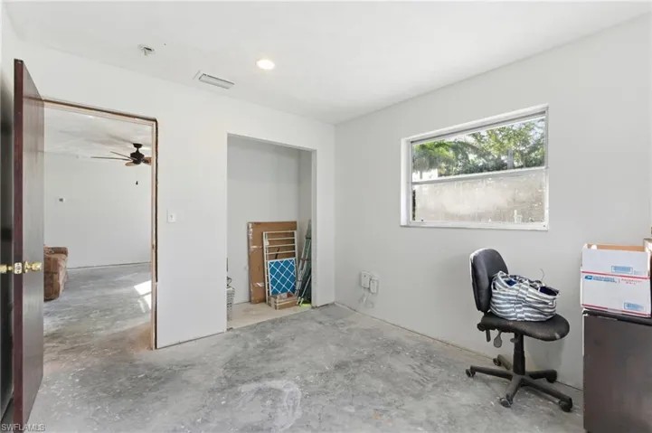 Office area with concrete flooring and ceiling fan
