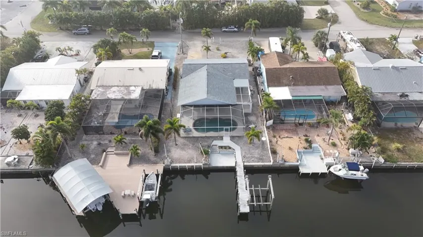 Aerial perspective of suburban area featuring a large body of water