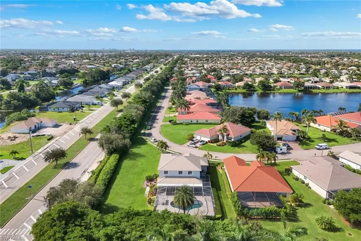 Aerial perspective of a developed residential area featuring various single-story homes