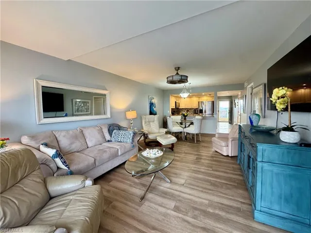 Living room with light hardwood / wood-style floors