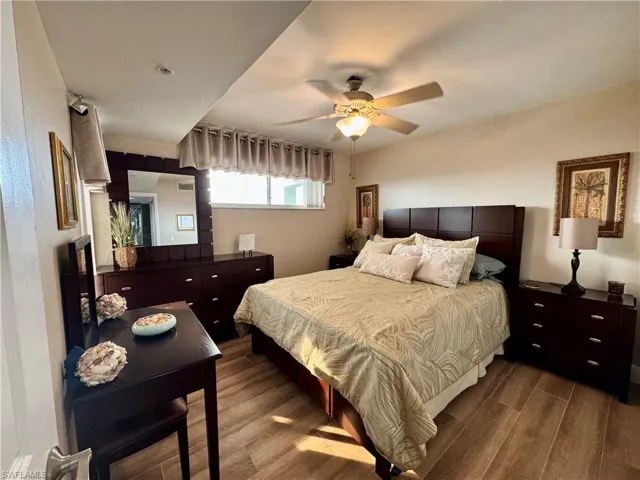 Bedroom featuring ceiling fan and hardwood / wood-style floors