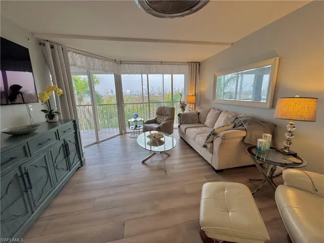 Living room with light hardwood / wood-style floors