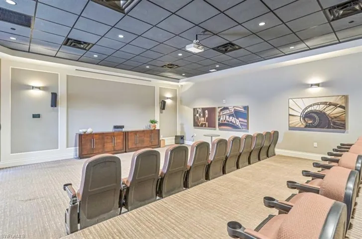 Home theater room featuring carpet floors and a drop ceiling