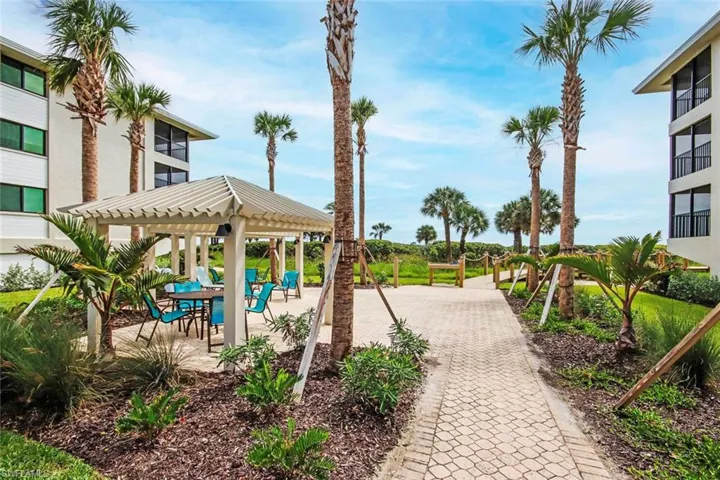Surrounding community with a pergola and a patio area
